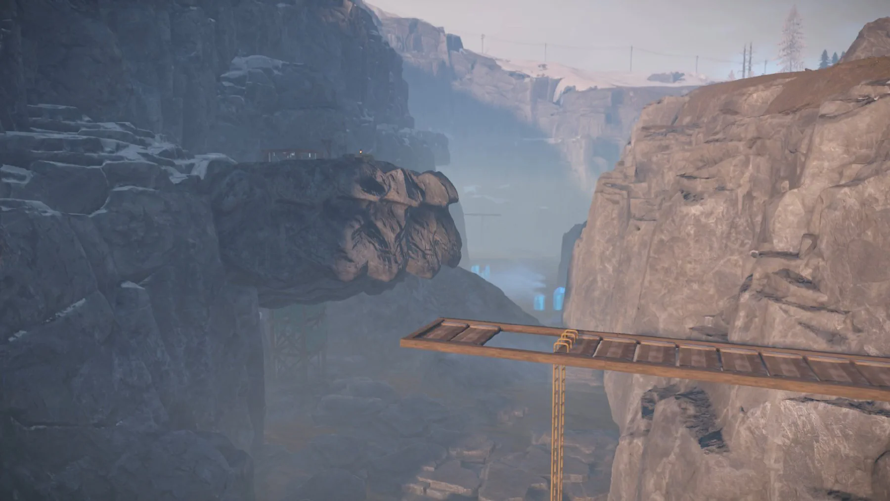 Makeshift bridge crossing a deep ravine
